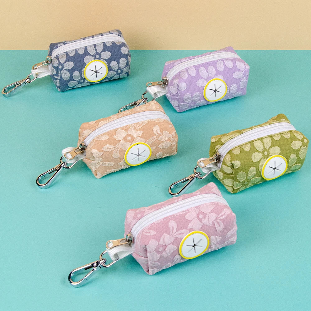Distributeur de sac à crotte fleuri en 4 couleurs : orange, vert, bleu et rose